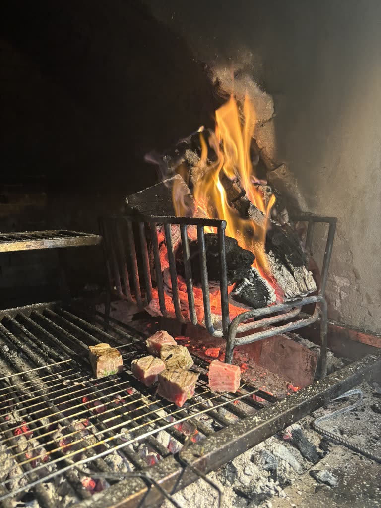 Beef grilled over open wood fire