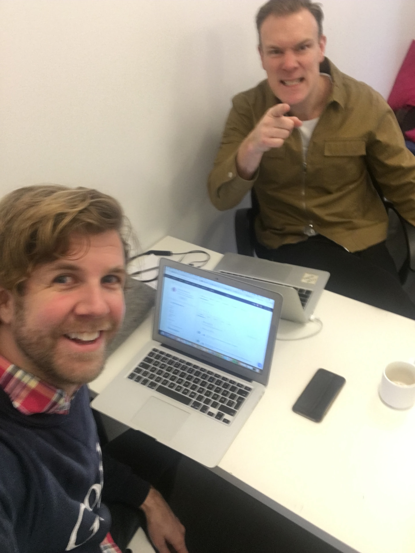 Martin and Fredrik Båge working on a laptop